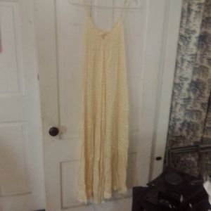 Long soft satin texture  pale yellow maxi dress with peekaboo back and bow .